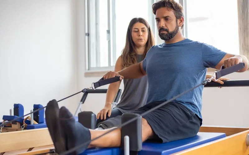 Sports physiotherapy session with advanced recovery equipment